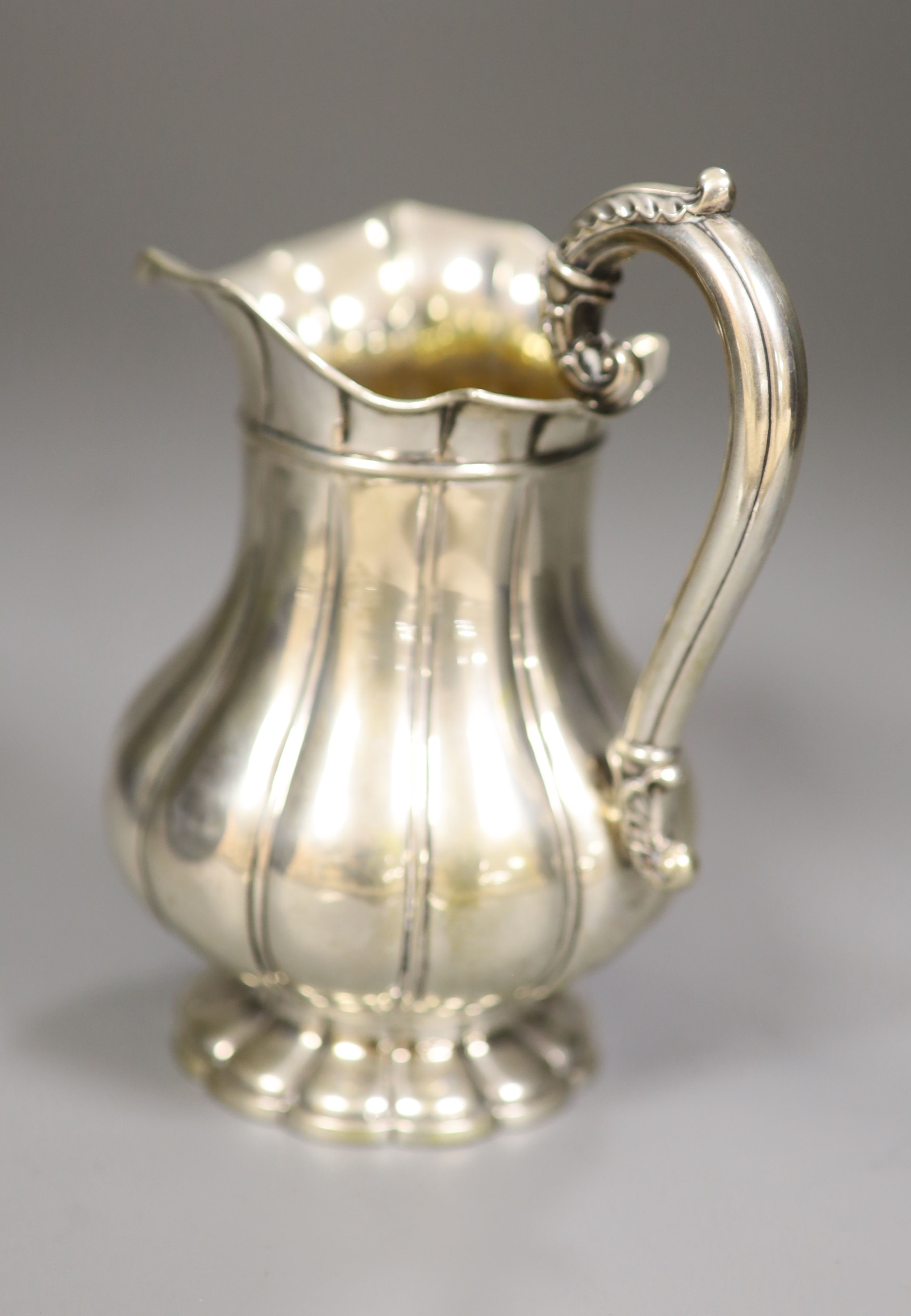 A 19th century continental white metal cream jug, 15.3cm, 9oz.